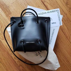 Kozha Numbers Zipper Utility Bag in black
